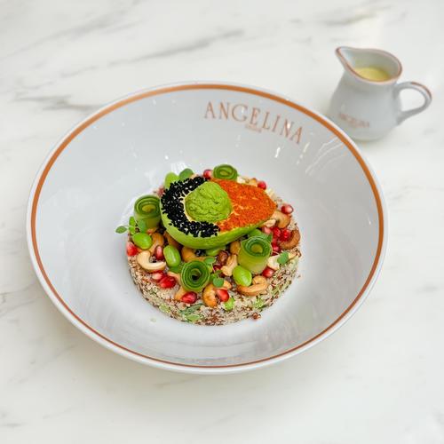 Vegan Quinoa Salad - Quinoa mix, sesame&paprika crusted avocado, edamame, peas hummus, mint, roasted cashews, pomegranate, pickled cucumber. Served with lemon dressing