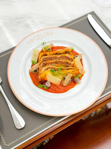 Beef Lasagna - Layers of pasta with seasoned ground beef, creamy bechamel sauce and topped with tomato sauce