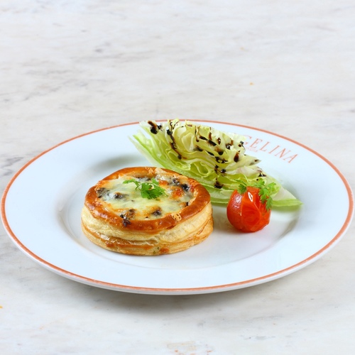 Mushroom quiche - Puff pastry, fried mushrooms, Parmesan, mozzarella, and emmental cheese, Iceberg lettuce.