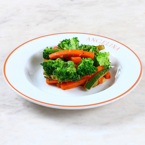 Pan-sauteed vegetables - Delicious dish with inspired vegetable blend pan-sautéed, served with asparagus, broccoli, and carrots, zucchini with salt, olive oil, black pepper powder, butter block, reserved garlic, and parsley.