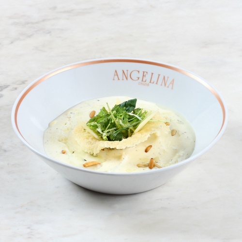 Spinach ricotta ravioli - Creamy sauce, confit truffle, pine nuts arugula.