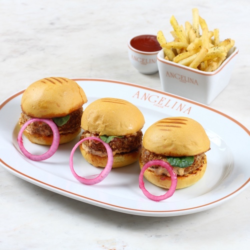 Halloumi mini burger - Potato bun, breaded halloumi, tomato concass, red shards, sour mayo and onion pickles. Served with French fries.