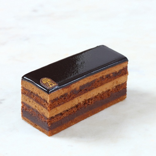 Opéra - For chocolates lovers, enjoy our delicious and fine OPERA pastry, made with Almond biscuit soaked in coffee, crunchy praline biscuit, and light coffee and milk chocolate&nbsp;mousse