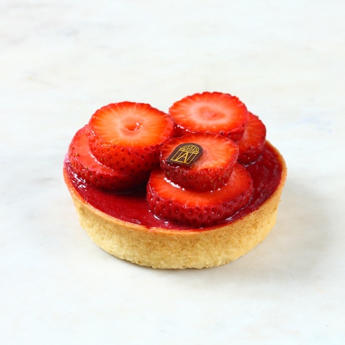 TART STRAWBERRY - Enjoy the balanced sweet and sour flavors of our Tarte strawberry tart, A classic French Sweet shell tart with vanilla ganache filled with smooth raspberry cream and fresh strawberry chunks.