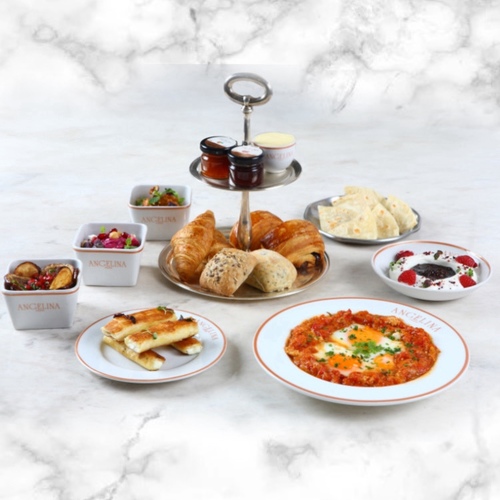 Kuwaiti breakfast - Bread selection and French butter, mini-viennoiseries. Artisanal jams and honey. Traditional homemade naan bread, shakshuka, beetroot humus, served with labneh. Fried eggplants&nbsp;ansgoat cheese filo pastry Your choice of 2 drinks (coffee or tea) or fresh juice