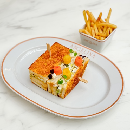 Parisian Club sandwich - Turkey, Emmental cheese, boiled eggs, mayonnaise mustard, Iceberg lettuce, French fries.