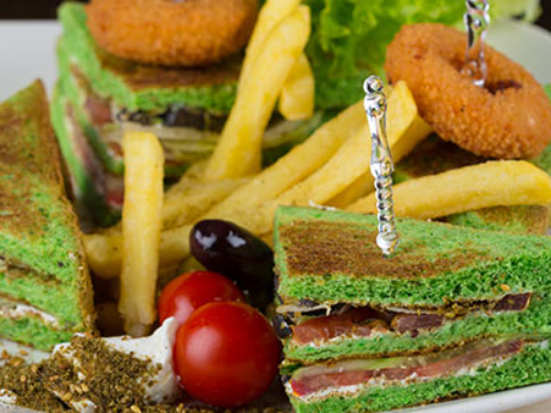 Club Sandwich With Zaatar And Labneh - Labnah - tomato - lettuce / with chips, one person meal 4 triangles.