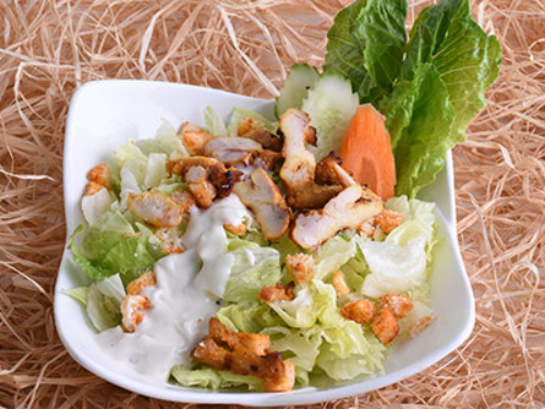 Caesar Salad - Lettuce, Parmesan cheese, Caesar sauce and bread crumbs by Shahryar special way.