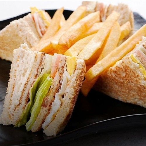 Club Sandwich with Chicken Musahab - Fried chicken - eggs - lettuce - tomato - mayonnaise - sliced cheese / chips, one meal 4 triangles.