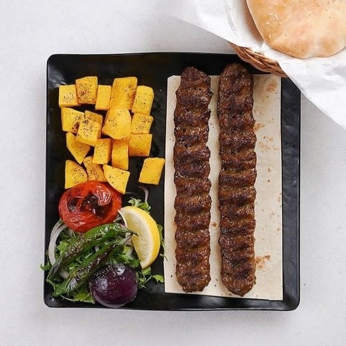 Kabab Koobideh - meat kabab platter, Mutabble, onions and grilled saffron with potatoes, Iranian bread, Hummus, salad