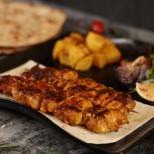 Shish Tawook - 8 pieces of shish tawouk served with Iranian bread and potatoes