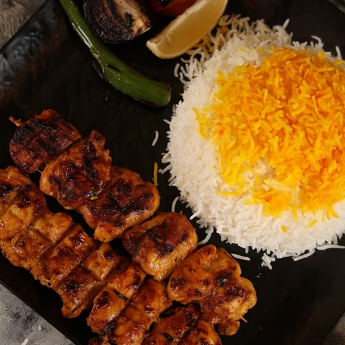 Gilio Tawook - 8 pieces of shish tawook with white rice, garlic and salad.