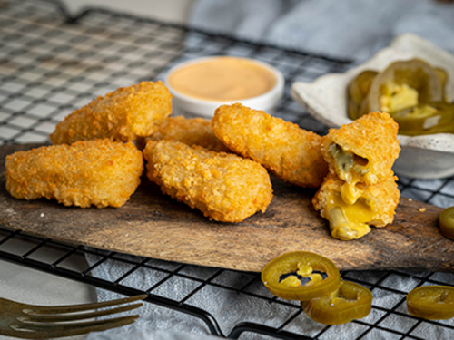 Jalapeno Cheese Ball - Freshly breaded baked stuffed with mixed cheese, and jalapeno, and served with spicy sauce.