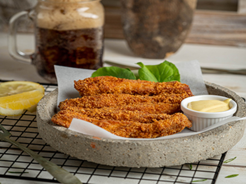 Chicken Tenders - Breaded chicken tenders served with honey mustard sauce.