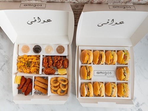 Diwaniya Box - Diwaniya box consists of your choice of 20 sliders, your choice of 5 drinks, with 3 pieces of fresh chicken tender mixed with buffalo sauce, 6 pieces of crispy onion rings, 3 pieces of a mozzarella stick, 6 pieces of hot chicken wings, 1 special chili fries, and with 4 types of sauces.