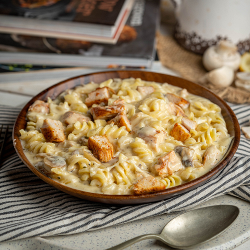 Creamy Pasta - Spiral pasta, chicken, mushroom, garlic, mozzarella cheese, parmesan cheese, spices and white sauce.