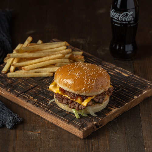 Amigos Burger Meal - Piece of Angus meat, fresh bun, lettuce, steamed onions, cheddar cheese, and special sauce.