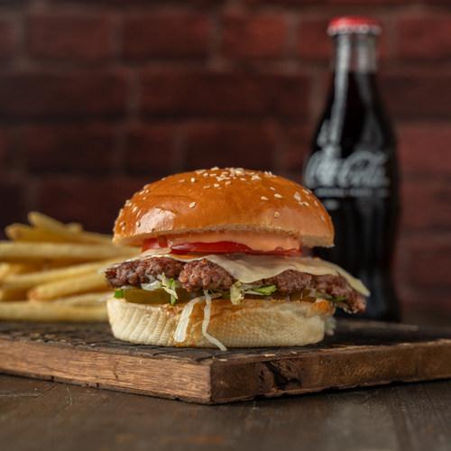 Texas Spicy Burger Meal - Piece of Angus meat, fresh oven baked bun, tomatoes, lettuce, spicy pepper jack cheese, jalapeno and spicy sauce.