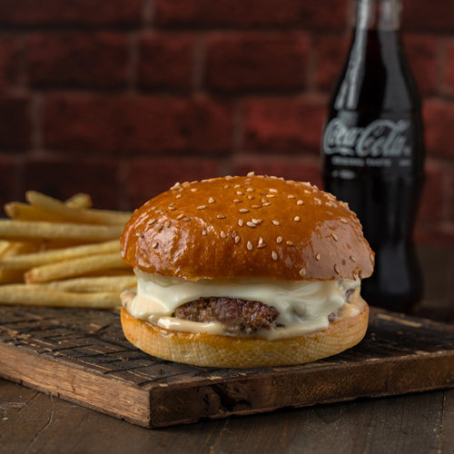 Truffle Burger Meal - Sesame Bread, Angus beef patty, Swiss Cheese, and Truffle Sauce, Served with Classic Fries and Drink.