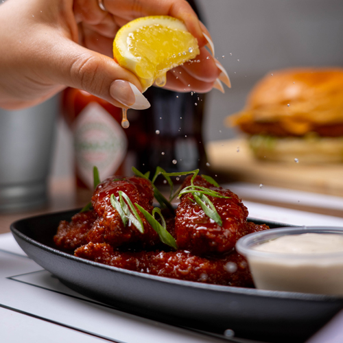 Buffalo Shrimp - 8 Pieces breaded shrimp cooked with sweetened buffalo flavor and served with buffalo sauce.