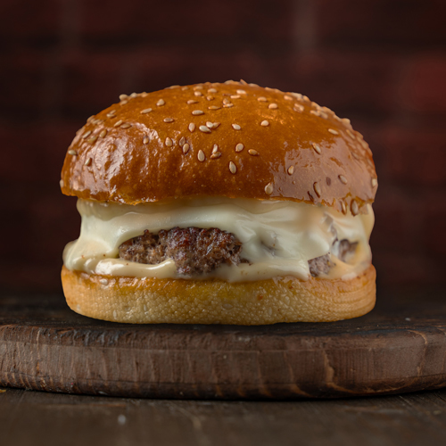 Amigos Burger - Truffle Burger Sandwich - Sesame Bread, Angus beef patty, Swiss Cheese and Truffle Sauce.