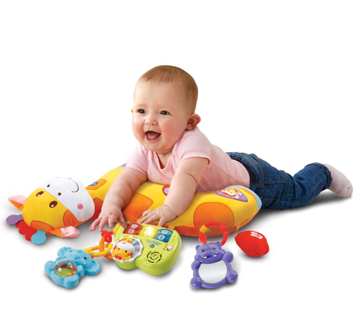 Toy Factory - VTech Tummy Time Discovery Pillow - Get comfy while having fun with the Tummy Time Discovery Pillow by VTech. This soft pillow features a friendly giraffe and provides comfortable support for your baby with three ways to play.