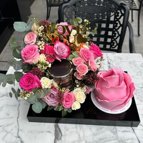 Package - MD 4 - Contains flower arrangement & jar of Pecan coated with small cake that has layers of red velvet and brownie and rich cheese cream, enough for 3 to 5 person