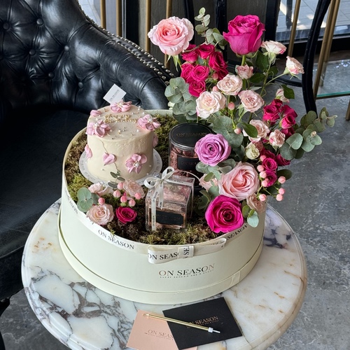 MDP - 3 - Contains flower arrangement, jar dates “ dates stuffed nuts and chocolate covered “ & Mixed crumble chocolate box & small cake that has layers of red velvet and brownie and rich cheese cream, enough for 3 to 5 person.