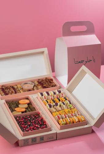 jamaeatuna mawalih - Three boxes, mini pastry box, 32 pieces, chicken musakhan box, 32 pieces with sauce, and mix box, grape leaves box, 42 pieces.