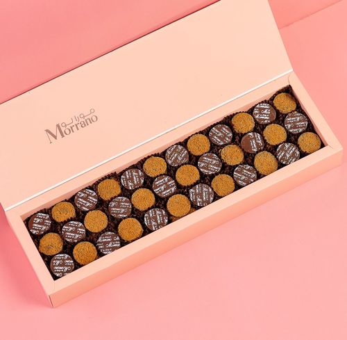 Twin Coins - Small pieces of milk chocolate, crunchy biscuits, butter, biscuit, lotus cream, salty pints and dolce caramel flavors Box 36 pieces