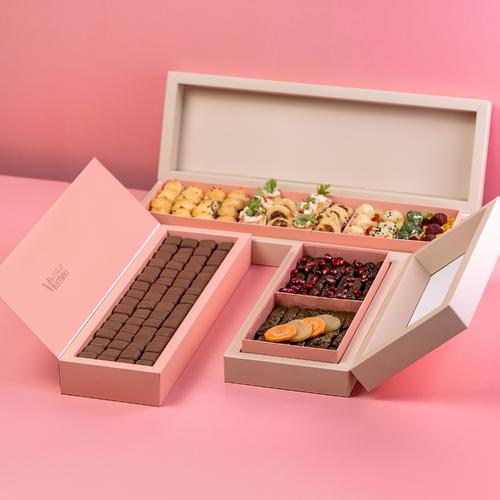 offer alzuwaaruh VIP - Offer three boxes of brownies with original flavour A box of 64 pieces, a box of mixed grape leaves, 42 pieces, and a box of small pieces of snacks prepared in the French style.  Box 42 pieces