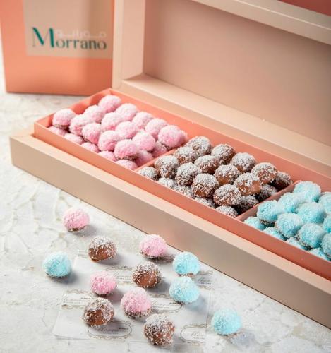 Marshmallow Bites - Three types of marshmallows Strawberry in pink, pineapple in blue And vanilla covered with a soft layer of Belgian chocolate and coconut Box of 100 pieces