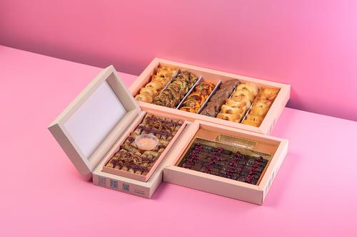 aldawam - Three-box offer: 36-piece pies, 32-piece chicken musakhan, and 40-piece grape leaves and pomegranate molasses.