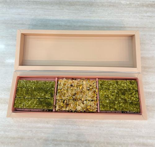 Pistachio - A soft pistachio cake with pistachio flavor, cream cheese, pistachios, and rahat and pistachio cream Box of 36 pieces