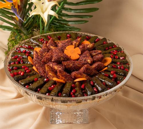مكس سولت - Mixed savory from 24 pieces of samosa Musakhan and 30 pieces of Pomegranate molasses grape leaves