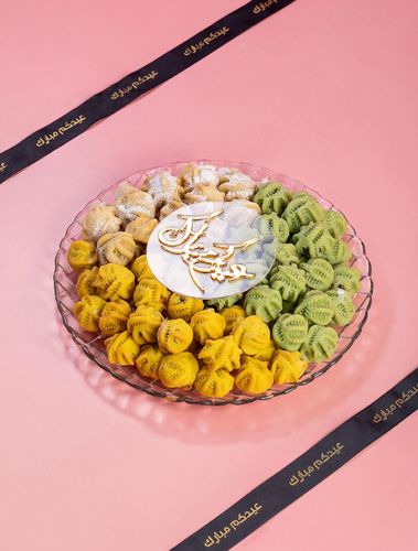 Eid maamoul - Small Maamoul Balls Pistachio Aleppo Semolina Stuffed with Dates and Pistachios Saffron Semolina Stuffed with Dates and Almonds Classic Malban Semolina Weight 800 grams