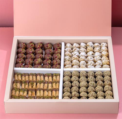 Mixed Shamiyat - Friday and visitor mix with a beautiful assortment of light Shami sweets Date maamoul, date balls with cardamom and nuts Kulaj fingers with cashews and Aqili discs with saffron and cocoa Box of 100 pieces
