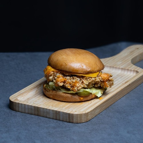 The Chicken Fillet - Fried chicken breast, cheddar cheese, lettuce, pickles, tomato, mayo.