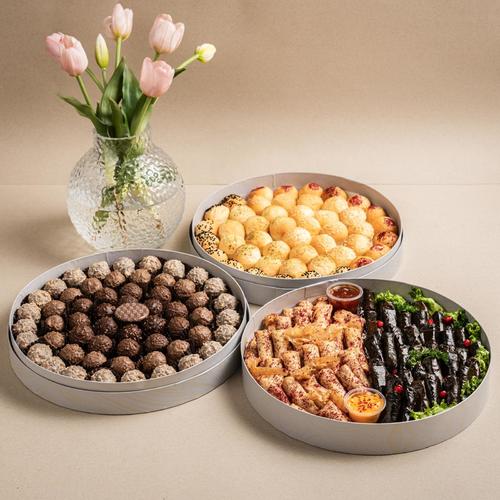 Offer three boxes - Elegant round mini sandwich box: 
Fillings: free potatoes - pickled eggplant - chickpeas with the chef's mixture 

Chef-style musakhan, grape leaves, pomegranate molasses 

Chocolate Truffle Flavors: Arabic Coffee, Kunafa Surf, Cinnabon, Sesame.