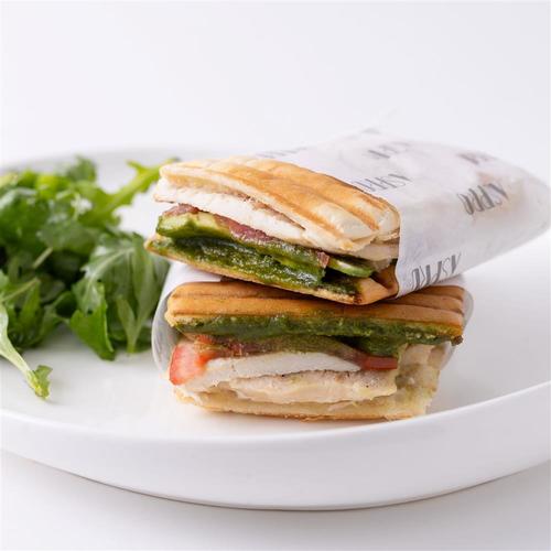 Chicken and Avocado sandwich - White ciabatta with chicken marinated with olive oil, sliced avocado, sliced tomato, basil pesto and aioli sauce served with mix salad.