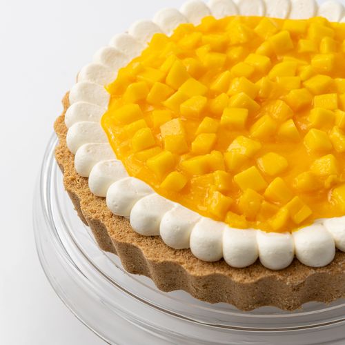 Mango Tart - Tart filled with mascarpone cream cheese, mango puree, topped with fresh chunks of mango.