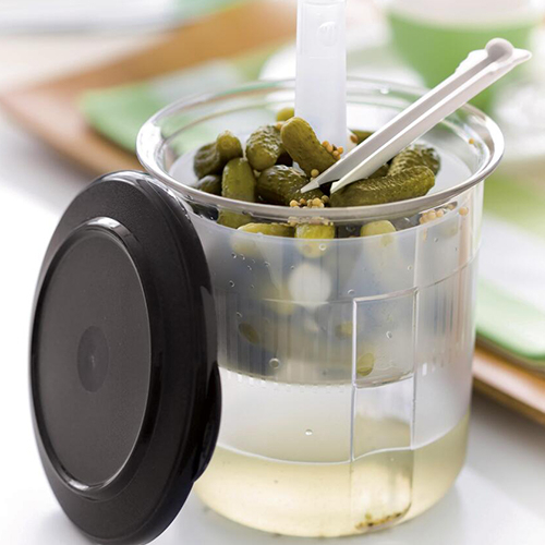 Pick it Quick - Serve and store with style gherkins or generous quantities of olives and pickles thanks to large capacity elegant container with an insert which is a generous size to hold large pickles and an integral pickle fork and an auto release cover.

Capacity: 1.5 L  
Dimensions: 14 cm Ø x 14.5 cm H