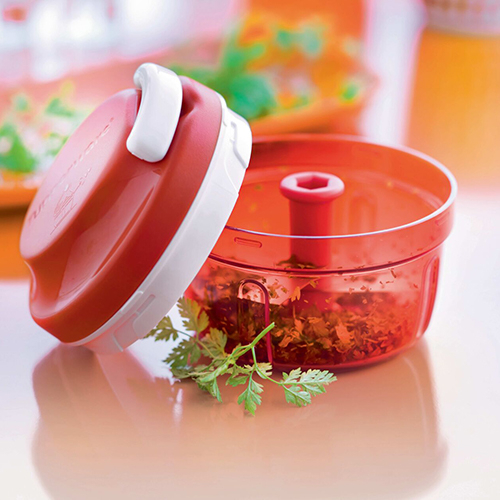 Herb Chopper 300 ML - Ideal for chopping herbs, garlic and small veggies like onions (no tears!), our famous Tupperware Herb Chopper has a pull-cord mechanism that saves time and effort and no electricity needed!
This kitchen gadget is a game changer when it comes to meal prep, so easy to use the whole family can jump in and help with food preparation, while enjoying things you never have time for.

Features and Benefits:
● Light and compact, the Herb Chopper uses minimal storage space..
● Make sure the Herb Chopper cover is safely locked before mixing.
● Place the Herb Chopper on the counter top. Hold it firmly by placing one hand on the cover and with the other hand pulling the cord in quick movements..
● While mixing, shake the Herb Chopper between cord pulling.
● Dry herbs carefully before chopping them
● Always remove blades first and then remove ingredients, using the Thin Silicone Spatula
● To measure small portions of your recipes, use the Multi Measuring Spoon..
● For dressing recipes made with oil, always add oil at the very end.
● Always cut meat, fish, vegetables and fruits into pieces before mixing with the Herb Chopper.
● The Herb Chopper is not a toy, keep away from children.
● Antiskid base to ensure the Herb Chopper is stable when in use.