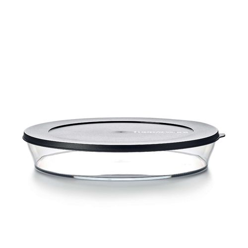 Clear Dish 2 L | Jet Black | Clearly Elegant® Series - Clearly Elegant® features a modular design and is part of an interlocking series, offering versatile and space-saving solutions. Each serving bowl comes complete with a base and a lid for added convenience.
Brand new Clearly Elegant® range now made from Eco+ material! With a glass-like look but a light-weight feel, the Clearly Elegant® range is perfect to prep, store, transport, serve and save! From fridge to table convenience these bowls are ideal for indoor or outdoor dining. The ECO+ material is made through a process that takes single-use plastics that would normally end up in landfill and gets recreated into a high-quality food grade container. You’re not only reducing waste, you’re creating less waste by using a product that can be used over and over again!  Specifications: Capacity: 2 L 
 Dimensions: L 29.6 x H 5.2 CM
 Color: Jet BlackBenefits: The modern, clear, glass-like appearance of these Bowls makes them suitable for use on the table and out and about.  Clear base allows you to see contents at a glance. Liquid tight Seals keep contents fresh and makes these bowls suitable for transporting treats to functions.  The tab on the Seal makes it easy to open and close and ideal for storing leftovers. When applied, the Seal creates a flat surface. Other bowls can be stacked on top–convenient. Each bowl nests inside each other. If you have storage space for the largest bowl in your kitchen you have room to store the entire collection!  Small and compact in any size kitchen. 
Use & Care:Dishwasher Safe however handwashing is highly recommended to preserve the shiny quality of the bowl. Place Seal on top rack of the dishwasher to avoid warping Not suitable for the microwave, freezer or oven Staining and scratches are normal and will not affect the performance of the product. This is not covered by Tupperware warranty. To avoid scratching, it is not recommended to store granulated sugar coated sweets or biscuits or to store coarse salt coated snacks Tupperware recommends plastic utensils to prevent damage to the product.  Do not use for citrus or ginger products, as discolouration may occur Suitable for cold foods only.