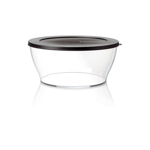 Clear Bowl 2.4 L | Jet Black | Clearly Elegant® Series - Clearly Elegant® features a modular design and is part of an interlocking series, offering versatile and space-saving solutions. Each serving bowl comes complete with a base and a lid for added convenience.
Brand new Clearly Elegant® range now made from Eco+ material! With a glass-like look but a light-weight feel, the Clearly Elegant® range is perfect to prep, store, transport, serve and save! From fridge to table convenience these bowls are ideal for indoor or outdoor dining. The ECO+ material is made through a process that takes single-use plastics that would normally end up in landfill and gets recreated into a high-quality food grade container. You’re not only reducing waste, you’re creating less waste by using a product that can be used over and over again!  Specifications: Capacity: 2.4 L 
 Dimensions: L 23.58 x H 10.16 CM
 Color: Jet BlackBenefits: The modern, clear, glass-like appearance of these Bowls makes them suitable for use on the table and out and about.  Clear base allows you to see contents at a glance. Liquid tight Seals keep contents fresh and makes these bowls suitable for transporting treats to functions.  The tab on the Seal makes it easy to open and close and ideal for storing leftovers. When applied, the Seal creates a flat surface. Other bowls can be stacked on top–convenient. Each bowl nests inside each other. If you have storage space for the largest bowl in your kitchen you have room to store the entire collection!  Small and compact in any size kitchen. 
Use & Care:Dishwasher Safe however handwashing is highly recommended to preserve the shiny quality of the bowl. Place Seal on top rack of the dishwasher to avoid warping Not suitable for the microwave, freezer or oven Staining and scratches are normal and will not affect the performance of the product. This is not covered by Tupperware warranty. To avoid scratching, it is not recommended to store granulated sugar coated sweets or biscuits or to store coarse salt coated snacks Tupperware recommends plastic utensils to prevent damage to the product.  Do not use for citrus or ginger products, as discolouration may occur Suitable for cold foods only.