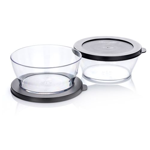 Clear Bowl 610 ML | Jet Black | Clearly Elegant® Series - Clearly Elegant® features a modular design and is part of an interlocking series, offering versatile and space-saving solutions. Each serving bowl comes complete with a base and a lid for added convenience.
 Ideal for daily use the 610ml bowl will be your go-to for snacks, cut-up fruits and berries and other delicious appetizers.   Brand new Clearly Elegant® range now made from Eco+ material! With a glass-like look but a light-weight feel, the Clearly Elegant® range is perfect to prep, store, transport, serve and save! From fridge to table convenience these bowls are ideal for indoor or outdoor dining. Ideal for daily use the 610ml bowl will be your go-to for snacks, cut-up fruits and berries and other delicious appetizers. The ECO+ material is made through a process that takes single-use plastics that would normally end up in landfill and gets recreated into a high-quality food grade container. You’re not only reducing waste, you’re creating less waste by using a product that can be used over and over again!    Specifications: Capacity: 610 ML 
 Dimensions: L 14.8 x H 6.5 CM
 Color: Jet BlackBenefits: The modern, clear, glass-like appearance of these Bowls makes them suitable for use on the table and out and about.  Clear base allows you to see contents at a glance. Liquid tight Seals keep contents fresh and makes these bowls suitable for transporting treats to functions.  The tab on the Seal makes it easy to open and close and ideal for storing leftovers. When applied, the Seal creates a flat surface. Other bowls can be stacked on top–convenient. Each bowl nests inside each other. If you have storage space for the largest bowl in your kitchen you have room to store the entire collection!  Small and compact in any size kitchen. 
Use & Care:Dishwasher Safe however handwashing is highly recommended to preserve the shiny quality of the bowl. Place Seal on top rack of the dishwasher to avoid warping Not suitable for the microwave, freezer or oven Staining and scratches are normal and will not affect the performance of the product. This is not covered by Tupperware warranty. To avoid scratching, it is not recommended to store granulated sugar coated sweets or biscuits or to store coarse salt coated snacks Tupperware recommends plastic utensils to prevent damage to the product.  Do not use for citrus or ginger products, as discolouration may occur Suitable for cold foods only.