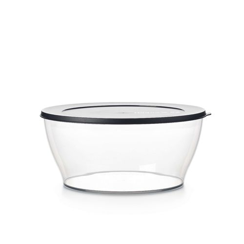 Clear Bowl 6 L | Jet Black | Clearly Elegant® Series - Clearly Elegant® features a modular design and is part of an interlocking series, offering versatile and space-saving solutions. Each serving bowl comes complete with a base and a lid for added convenience.
Brand new Clearly Elegant® range now made from Eco+ material! With a glass-like look but a light-weight feel, the Clearly Elegant® range is perfect to prep, store, transport, serve and save! From fridge to table convenience these bowls are ideal for indoor or outdoor dining. The ECO+ material is made through a process that takes single-use plastics that would normally end up in landfill and gets recreated into a high-quality food grade container. You’re not only reducing waste, you’re creating less waste by using a product that can be used over and over again!  Specifications: Capacity: 6 L 
 Dimensions: L 29.6 x H 13.3 CM
 Color: Jet BlackBenefits: The modern, clear, glass-like appearance of these Bowls makes them suitable for use on the table and out and about.  Clear base allows you to see contents at a glance. Liquid tight Seals keep contents fresh and makes these bowls suitable for transporting treats to functions.  The tab on the Seal makes it easy to open and close and ideal for storing leftovers. When applied, the Seal creates a flat surface. Other bowls can be stacked on top–convenient. Each bowl nests inside each other. If you have storage space for the largest bowl in your kitchen you have room to store the entire collection!  Small and compact in any size kitchen. 
Use & Care:Dishwasher Safe however handwashing is highly recommended to preserve the shiny quality of the bowl. Place Seal on top rack of the dishwasher to avoid warping Not suitable for the microwave, freezer or oven Staining and scratches are normal and will not affect the performance of the product. This is not covered by Tupperware warranty. To avoid scratching, it is not recommended to store granulated sugar coated sweets or biscuits or to store coarse salt coated snacks Tupperware recommends plastic utensils to prevent damage to the product.  Do not use for citrus or ginger products, as discolouration may occur Suitable for cold foods only.