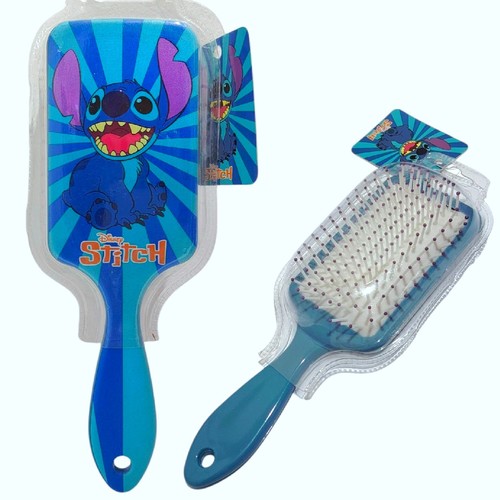 Stitch Paddle Hair Brush 10186 - Design: Features a vibrant, playful illustration of Stitch against a blue starburst background on a rectangular paddle shape.Functionality: Designed with soft, flexible plastic bristles and an air-cushioned base to gently detangle knots and provide a comfortable massage while brushing.Ergonomics: Includes an easy-grip handle suitable for small hands, helping minimize hair breakage and discomfort.