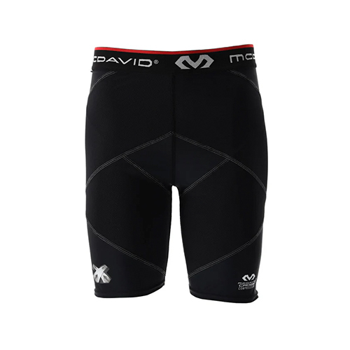 Padel Store - McDavid 8201 Super Cross Compression With Hip Spica Black Short - Our best selling compression short received a well-deserved update with - as we call it - SUPER compression. Crafted from breathable, high-tenacity technical fabric, our latest offering takes inspiration from the taping techniques employed by athletic trainers. The result? Superb support for your hamstring, glute, and quad muscles. With an added emphasis on bolstering the hamstrings, quadriceps, and groin, our Cross Compression Shorts create a secure hip spica wrap that specifically envelops the hip flexors during use, effectively reducing the risk of groin injuries. These shorts are designed to provide optimal support during any sports activity and cater to everyone seeking to warm up and stabilize their muscles while engaged in sports.