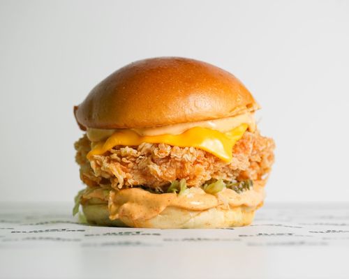 Spicy Chicken Sandwich - chicken patty+ yellow cheese + spicy sauce+ lettuce+ pickels & bun